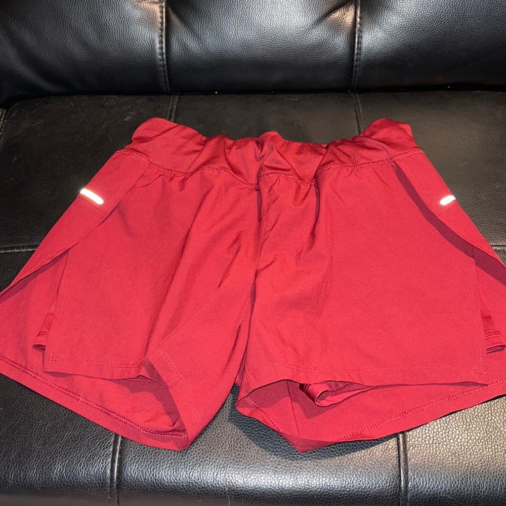 Cute dark red Avia shorts with slit and built in shorts